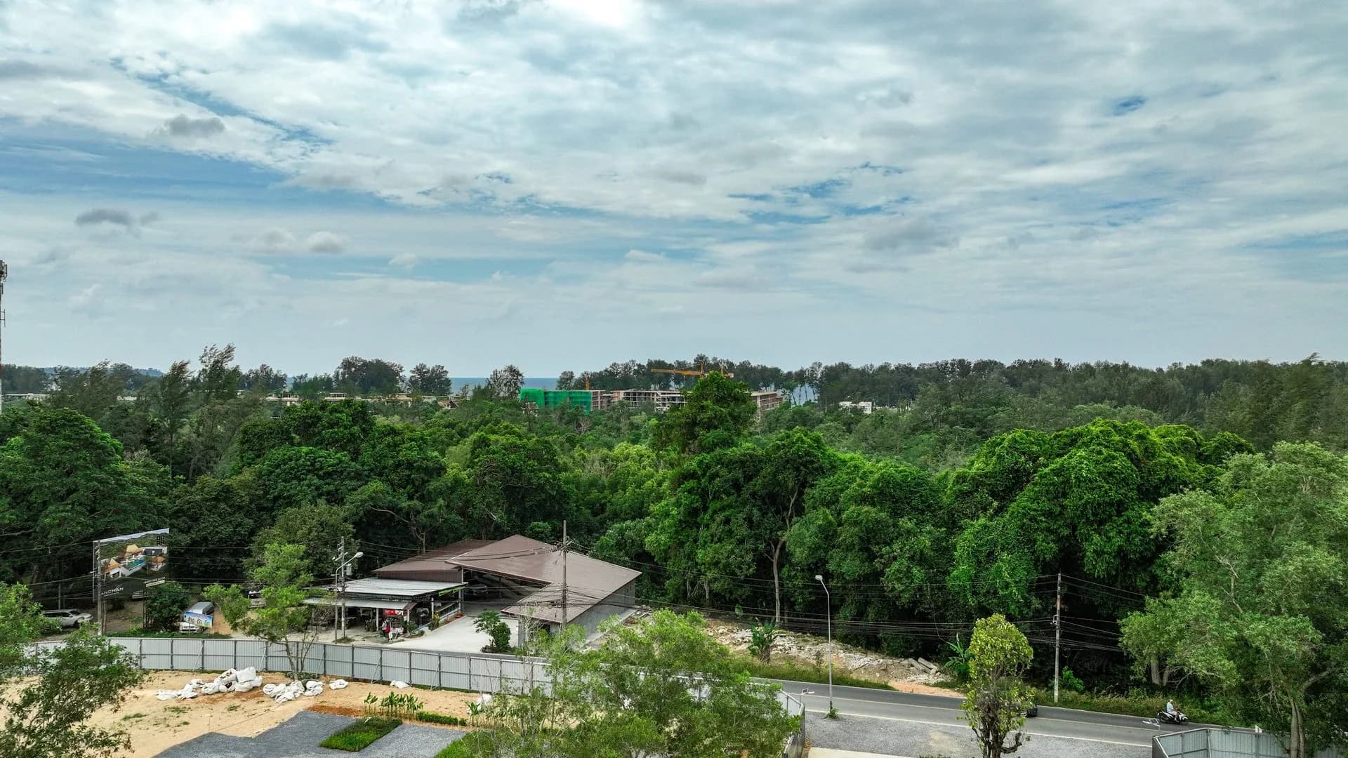 Roadside edge of the Layan Verde site with active works beyond