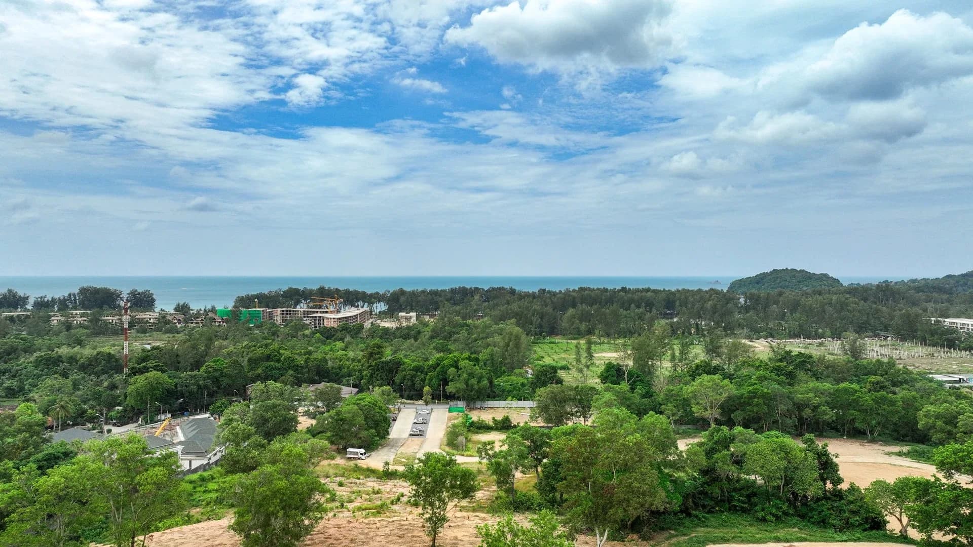 Layan Verde access area with the sea and coastal headland beyond